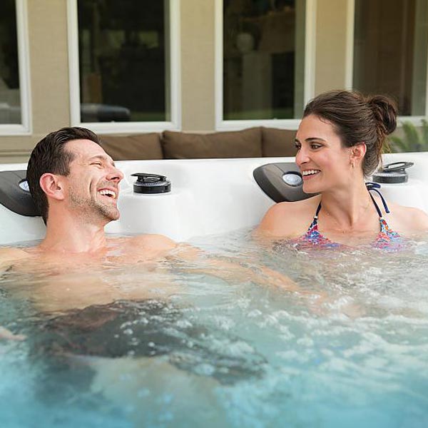 couple relaxing in hot tub